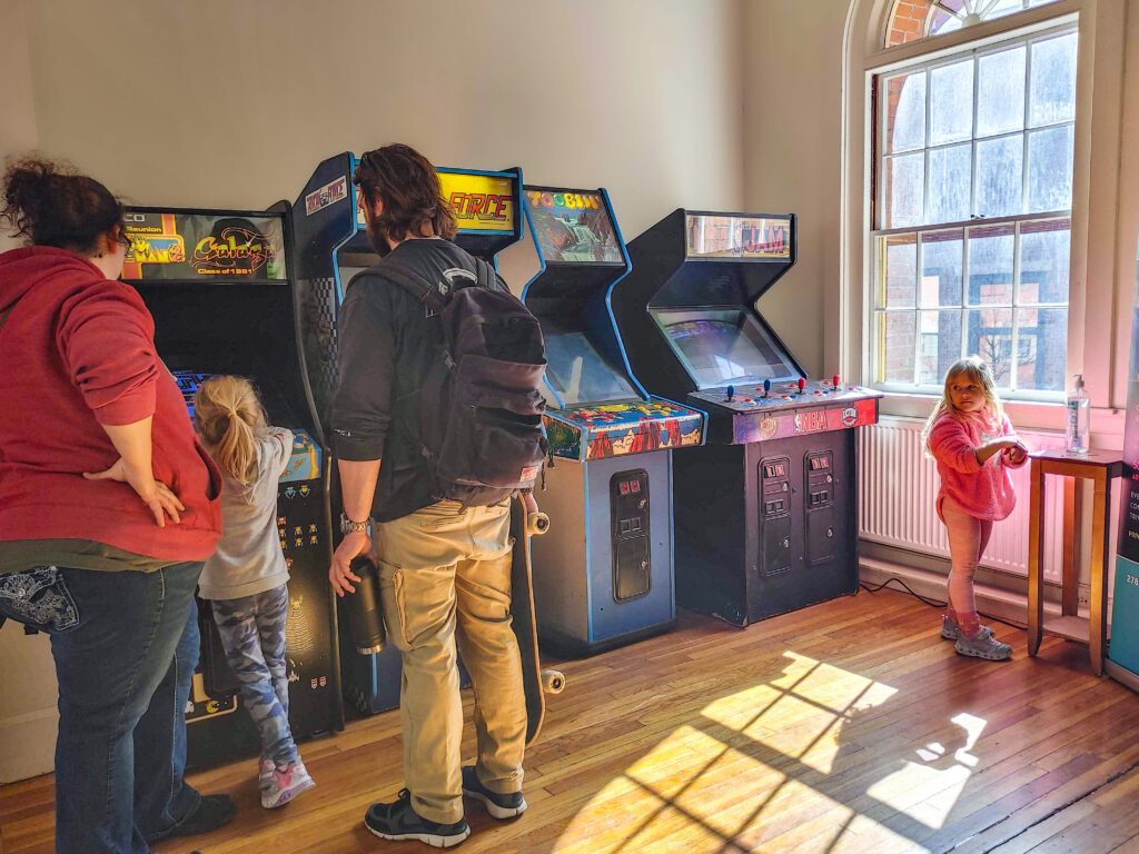 A family playing with vintage games in Old Town Hall.