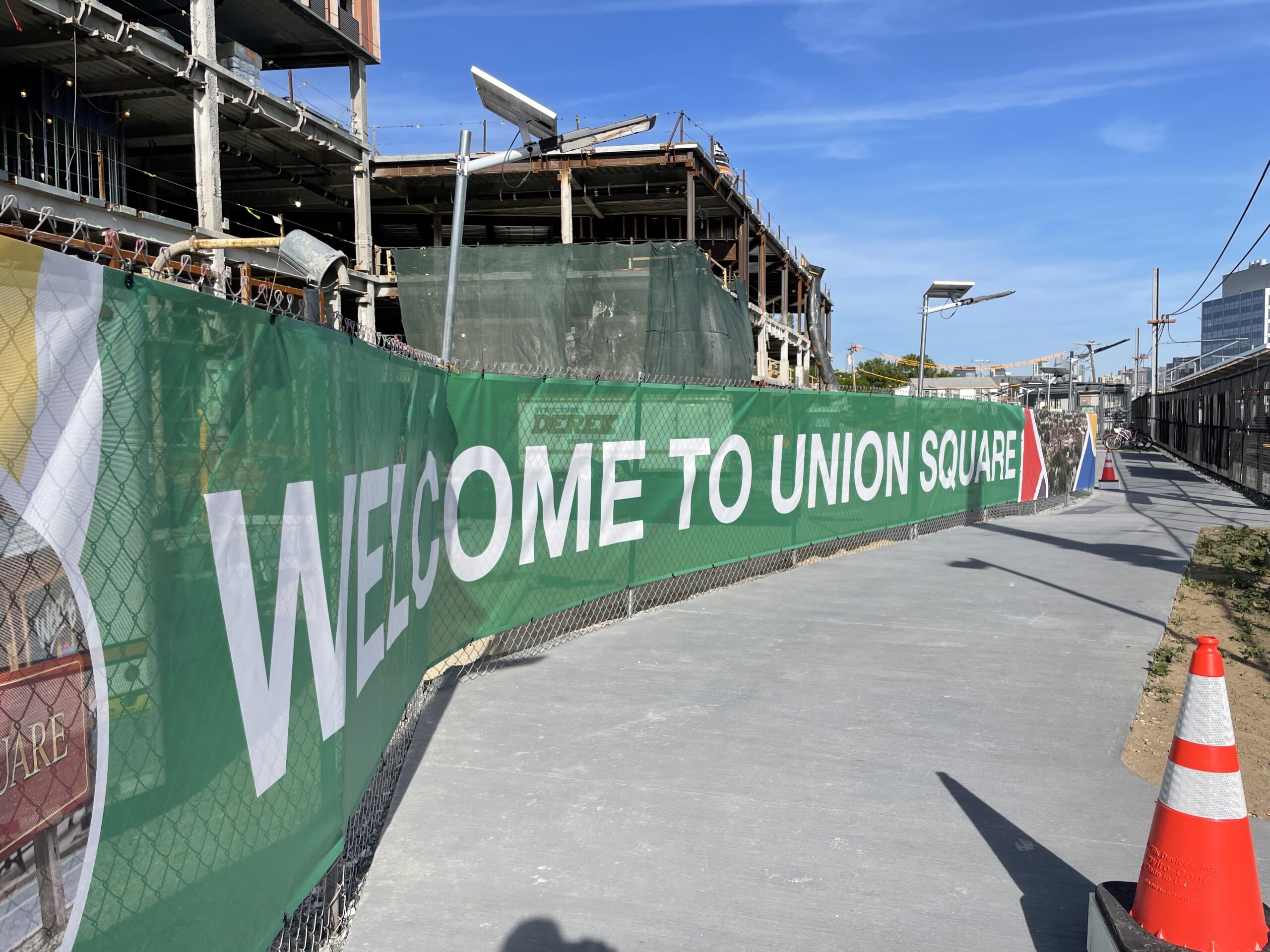 A long green scrim reads Welcome To Union Square.