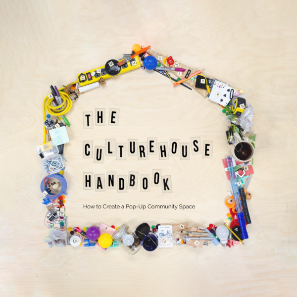A collection of small objects arranged in the shape of a house. Inside the house is text that reads "The CultureHouse Handbook: How to Create a Pop-Up Community Space."