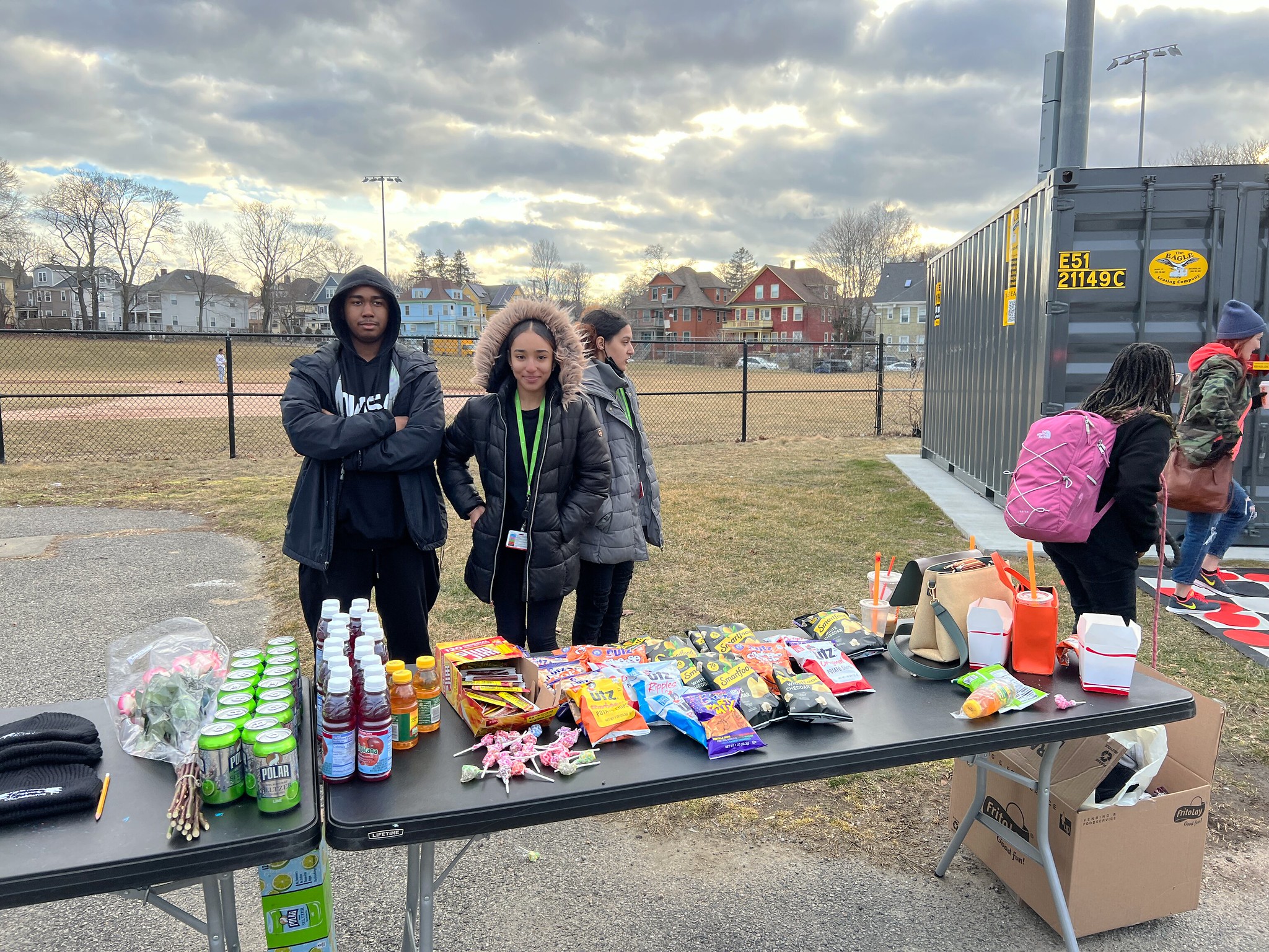 Teens from Fields Corner Crossroads Collaboration provide snacks for the event.