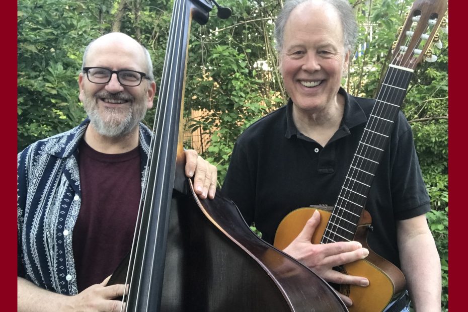 Two men holding string musical instruments