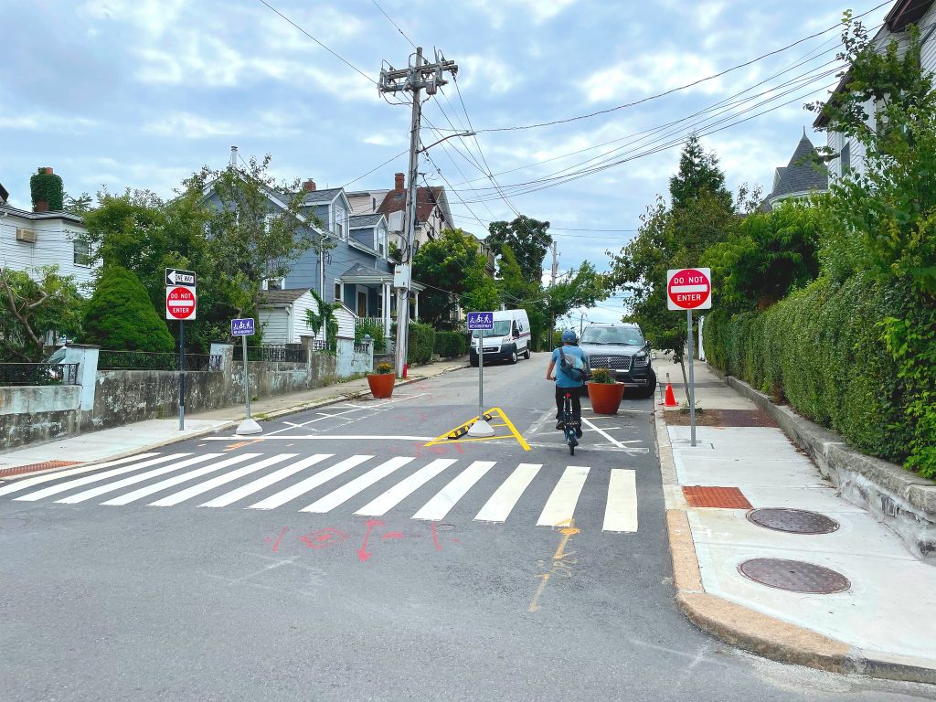 A person biking contraflow on Glen Street.