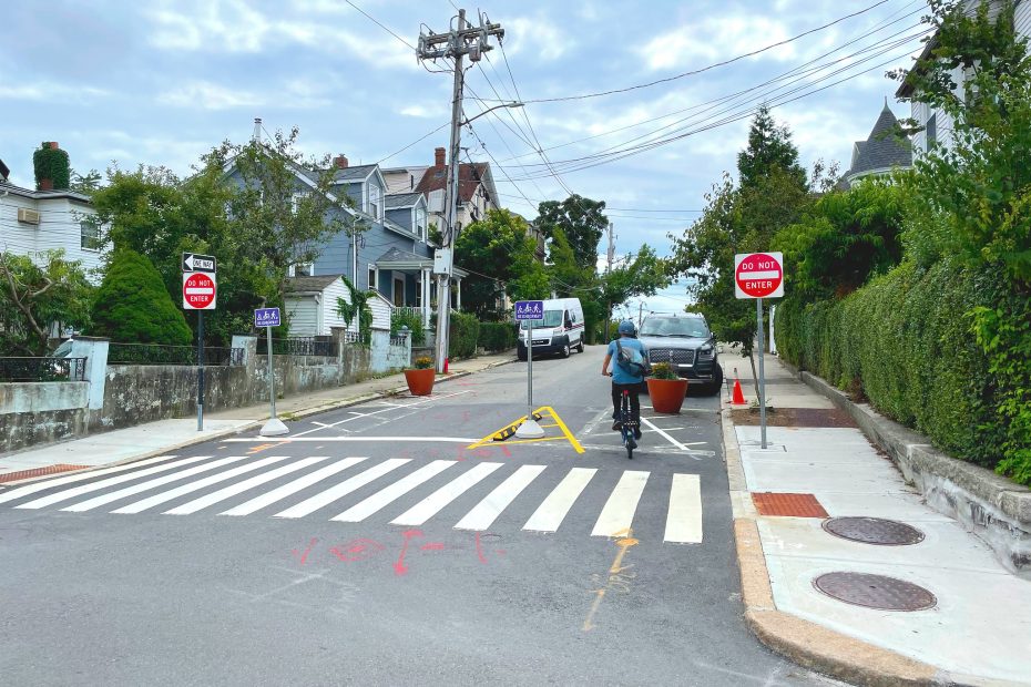 A person biking contraflow on Glen Street.