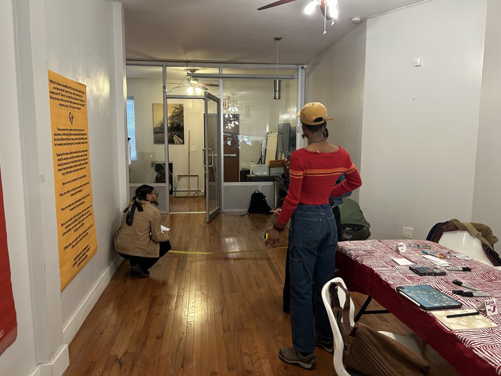 People measure space dimensions in a new pop-up site.